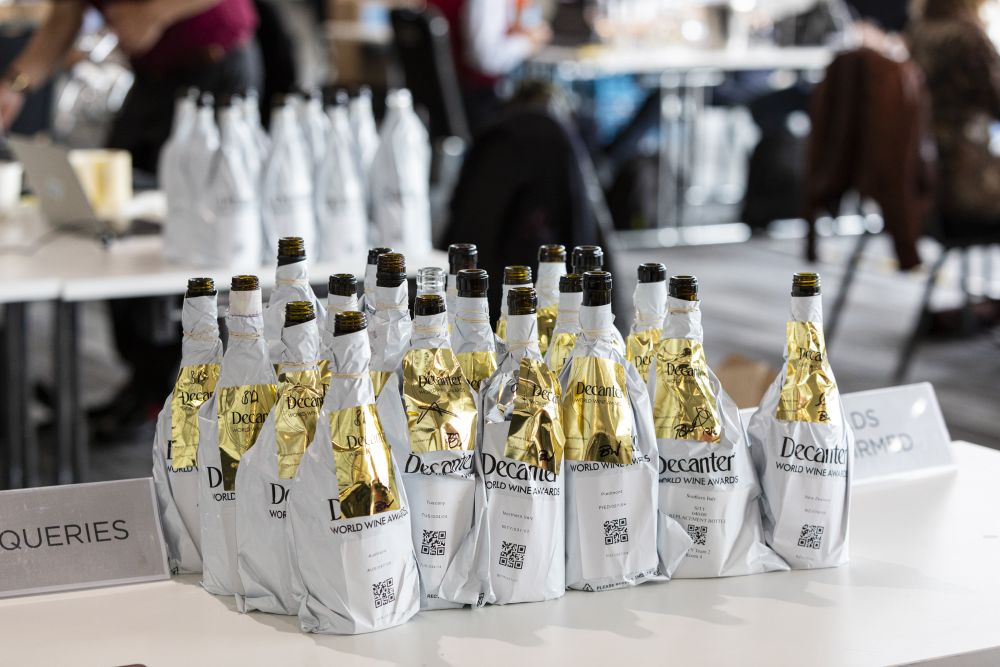 Thousands of organized wine bottles awaiting blind tasting at the Decanter World Wine Awards.